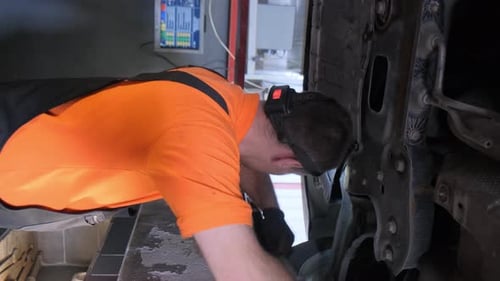 The Car is Standing on a Stand for Adjusting Car Wheels in a Car Workshop Vertical Video