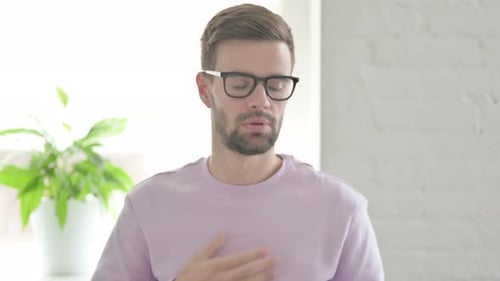 Portrait of Sick Young Man Coughing