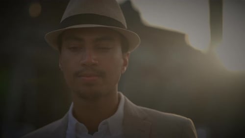 Fashionable Young Handsome Man Wearing a Hat and Casual Clothes in the City