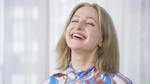 Smiling Blonde Woman Poses for Camera