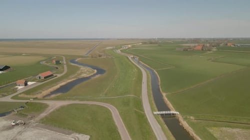 Aerial view of dutch countryside with cyclists at summer, Netherlands