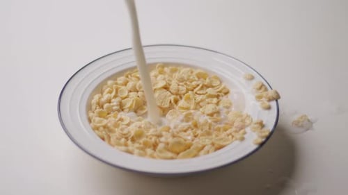 Pouring Milk Into Corn Flakes Close Up
