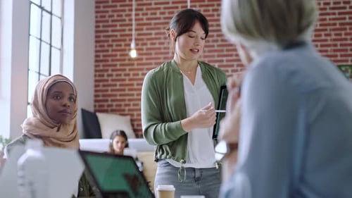 Business Woman Giving Presentation in Modern Office