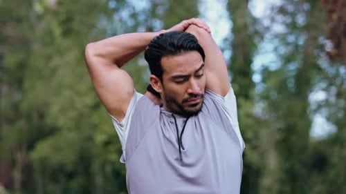 Healthy, workout and fitness stretching man in a forest during his morning exercise