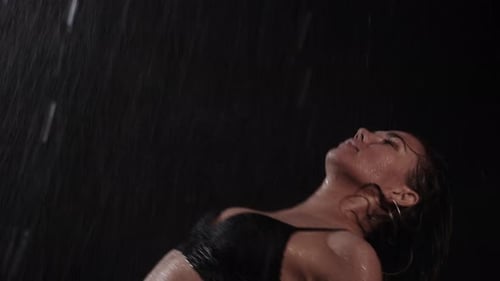 Sensual Woman in Lingerie Standing in the Rain