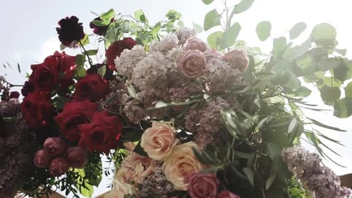Closeup Shot View of Wedding Wooden Arch and Floral Decorations of Flowers in Pastel Faded Colors