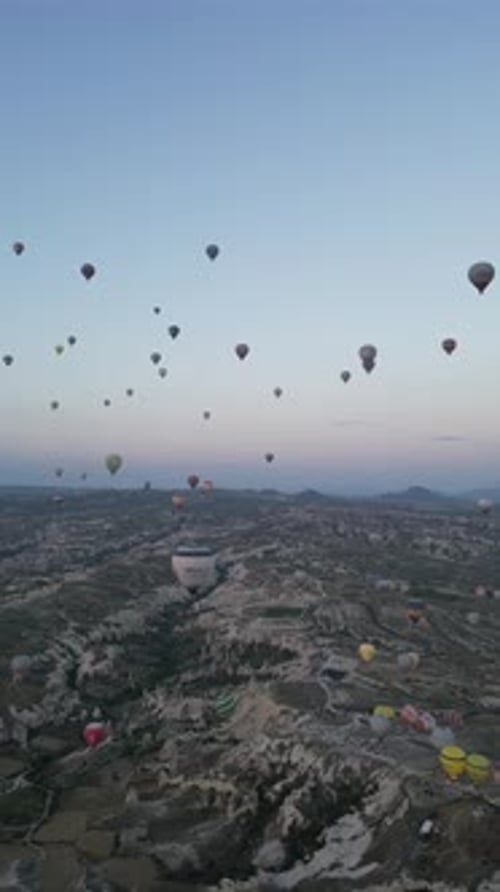 Aerial video over monoliths in Cappadocia, on hot air balloons, Turkey