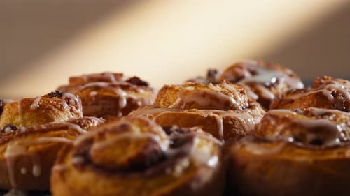 Delicious Cinnamon Rolls with Sweet White Icing Close Up