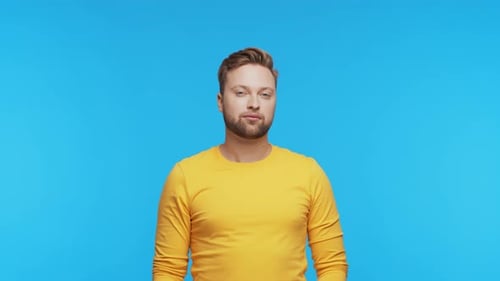 Expressive Young Man Over Vibrant Background Studio Portrait of Handsome Person