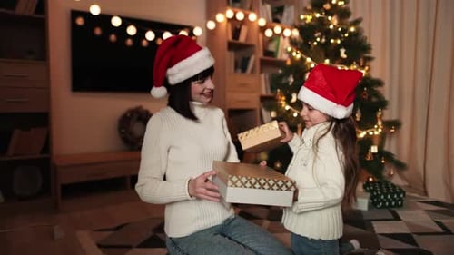 Woman and Child Exchanging Christmas Gifts