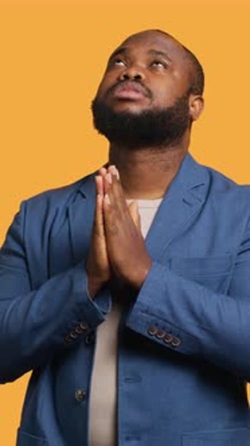 Vertical Video Man Praying to His God Asking for Forgiveness Studio Background