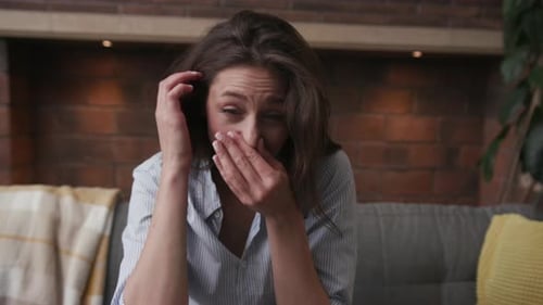 Young Woman with Runny Nose Blows It