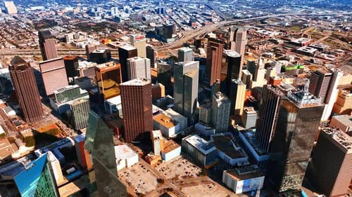 Flying high above the downtown of Dallas, Texas, USA. Scenic view of the metropolis from top.