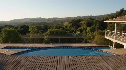 Sunset time lapse of a beautiful pool. Sunset by the pool