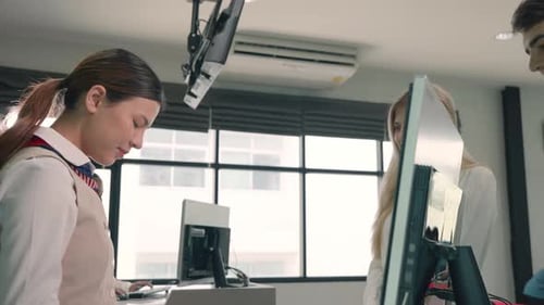 young couple check in counter at international airport and woman staff receiving boarding passes