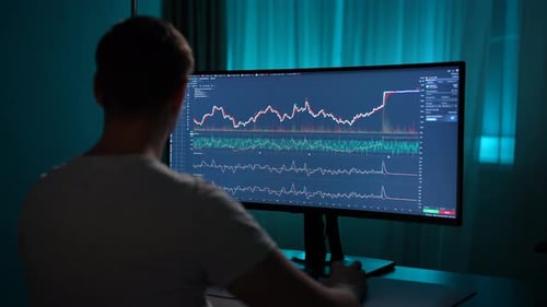 View From Shoulder of Unrecognizable Male Trader Analyzing Strategy for Stock Market Investment at