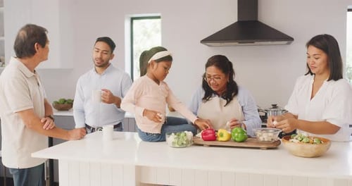 Family Prepares Food Together in a Modern Kitchen