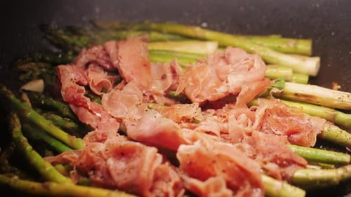 Grilled Green Asparagus with Jamon Pork Bacon Beef Cast Iron Plate Chef Cooking Spanish Traditional