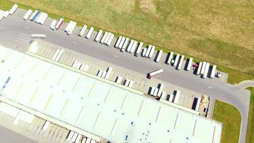 Aerial view of warehouse storages or industrial factory or logistics center from above. Top view of
