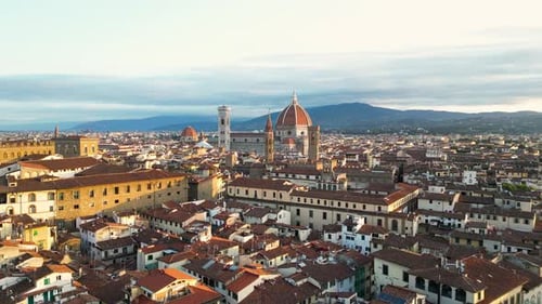 Forwards Fly Above the Streets and Buildings of Florence City Cathedral Italy