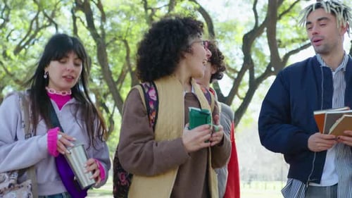 Groupmates Walking in Park and Chatting after College Day