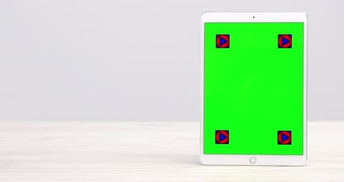 4k video footage of a digital tablet with a green screen flipping to stand upright on a desk