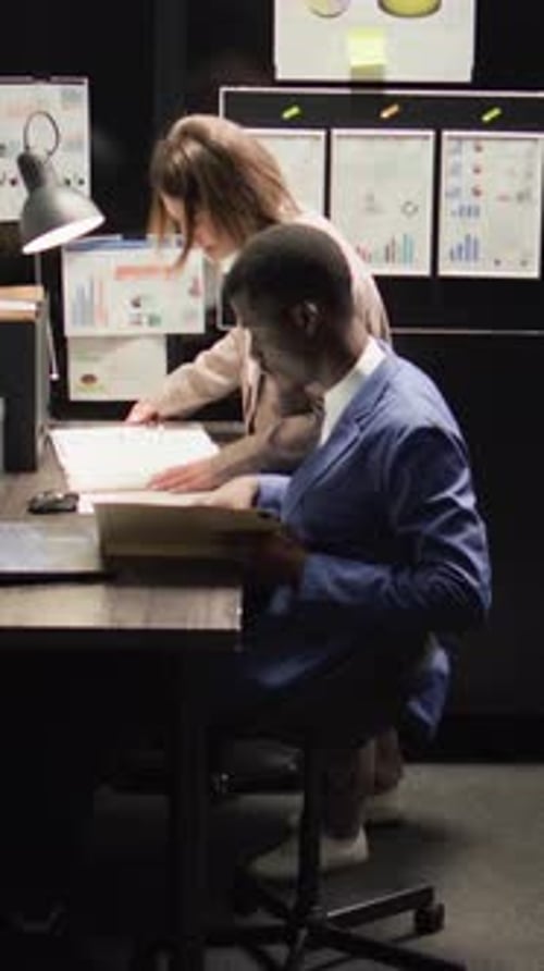 Colleagues Reviewing Business Documents in the Office