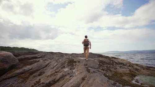 In the Heart of Norway's Untamed Wilderness a Man Embarks on a Solitary Journey Walking Along a