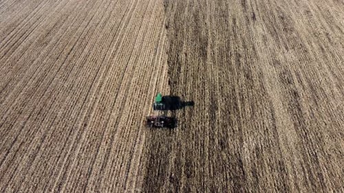 Green Tractor Plow Plowing Field Soil Harvest Digging Soil After Mowing Field