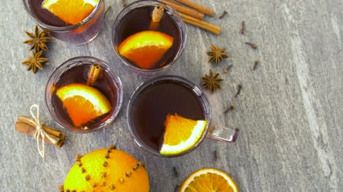 Christmas and Seasonal Drinks Concept - Glasses of Hot Mulled Wine With