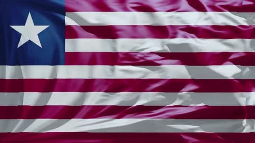 Liberia Flag Waving in Wind Seamless Loop Background