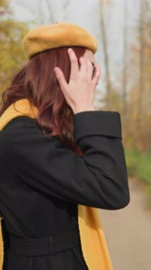 Woman Strolling in Autumn Park