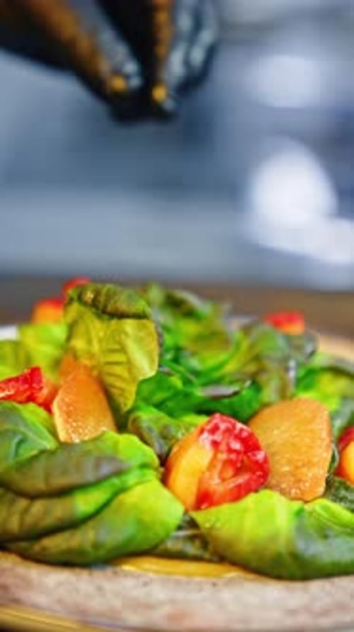 Chef Preparing Salad in Modern Kitchen