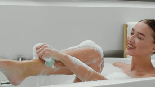 Woman Enjoying a Relaxing Bubble Bath at Home