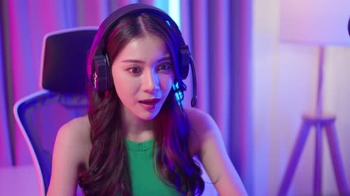 Young Woman Concentrating and Smiling While Gaming