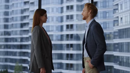 Business people shake hands after successful agreement in modern office