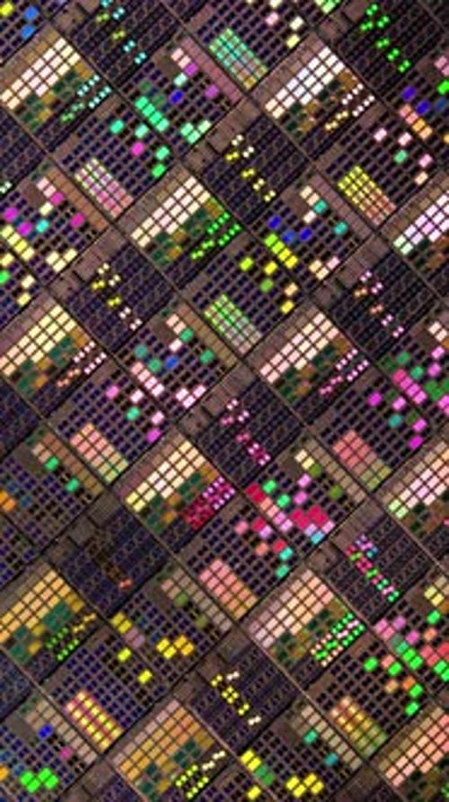 Vertical video Silicon semiconductor wafer with integrated circuit die mosaic pattern.