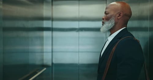 Business, man and elevator in office, building and leaving company of professional corporate