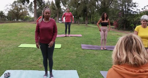 People Doing Yoga Class at City Park - Healthy Lifestyle Concept Body