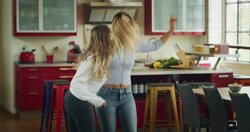 Two Women Dancing Together in Home Kitchen
