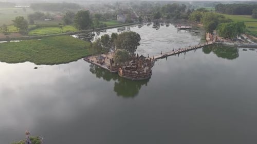 Aerial View Of A Body Of Water With Structures And Landscape Features