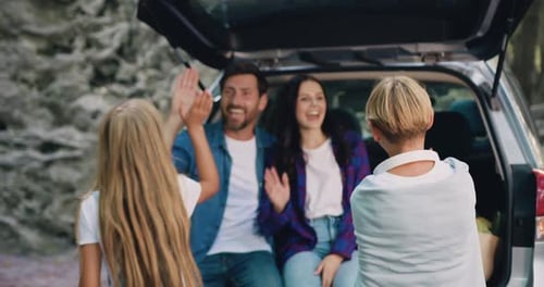 Family Bonding in Nature by Car Trunk