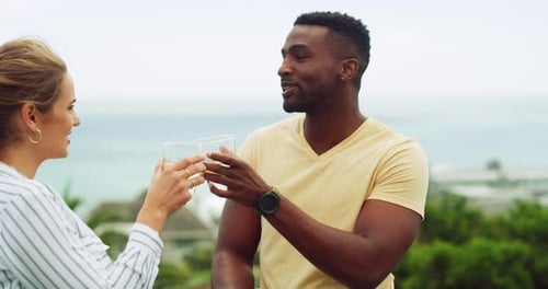 Couple Talking, Drinking, With Tropical Ocean View