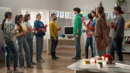 Colleagues Celebrate Birthday in Decorated Office