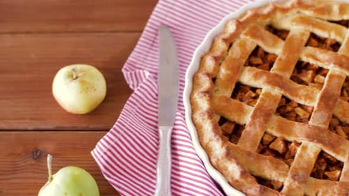 Delicious apple pie dessert still life on rustic wooden table overhead view