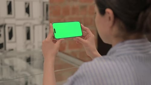 Businesswoman Holding Phone with Chroma Key Screen