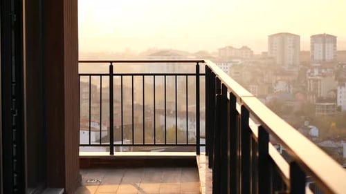 Sunset View From a Balcony Overlooking the City Skyline