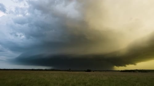 Spectacular Storm Spins as it Moves Closer in the Fading Colorful Evening Light.