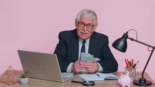 Senior Business Office Man Accountant or Banker Making Money Cash Calculations Income Earnings