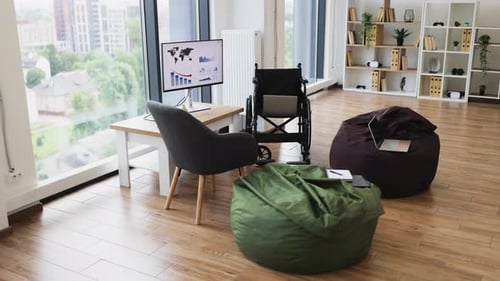 Modern Workspace with Wheelchairs Computers and City View for Accessibility